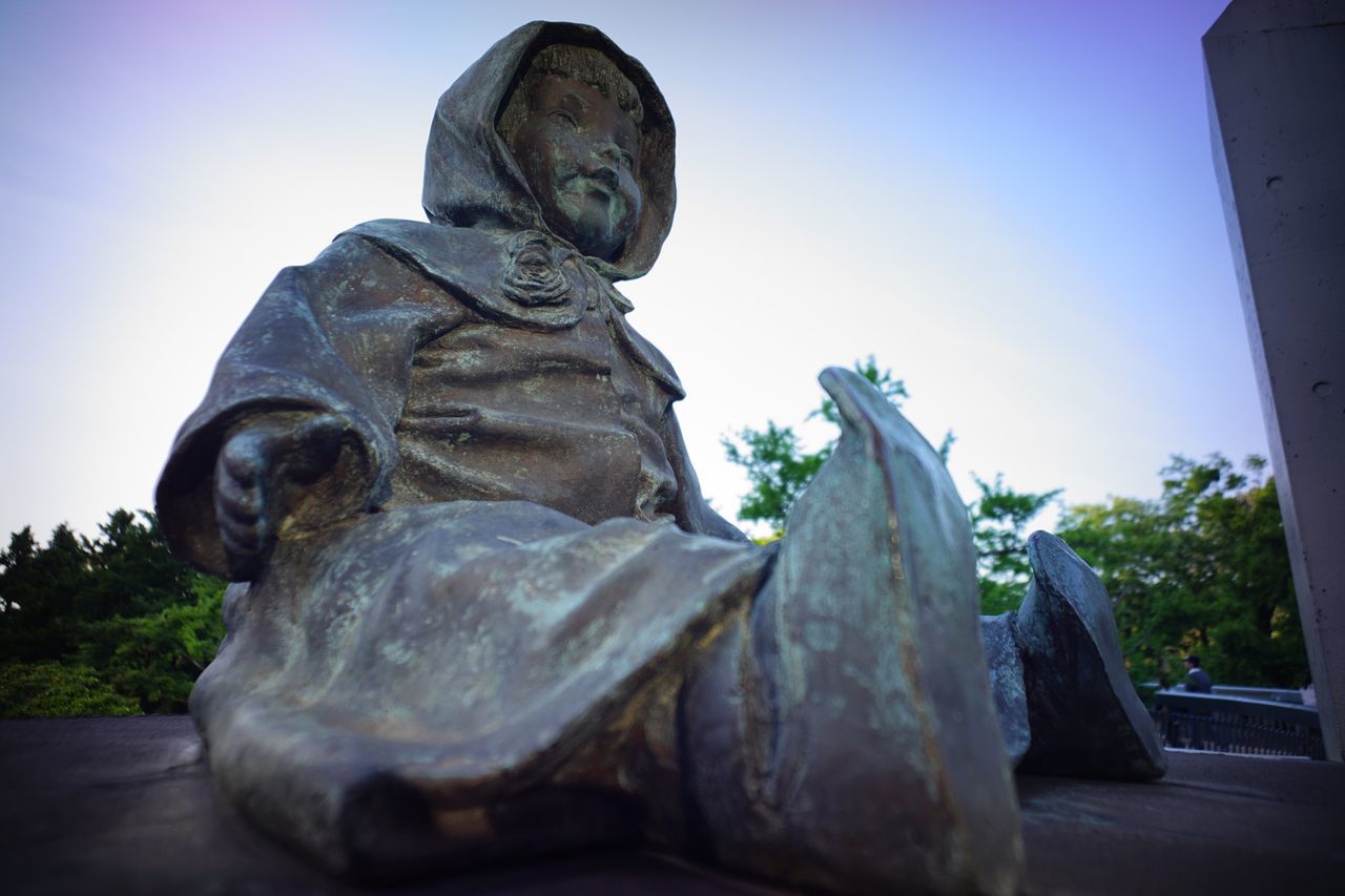 statue, sculpture, human representation, art and craft, art, creativity, clear sky, low angle view, carving - craft product, built structure, religion, animal representation, architecture, monument, tree, history, sky, spirituality