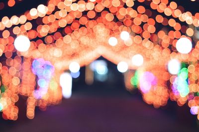 Low angle view of illuminated lights at night