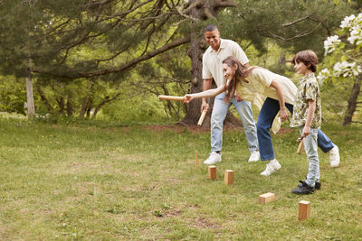 People playing molkky outdoors