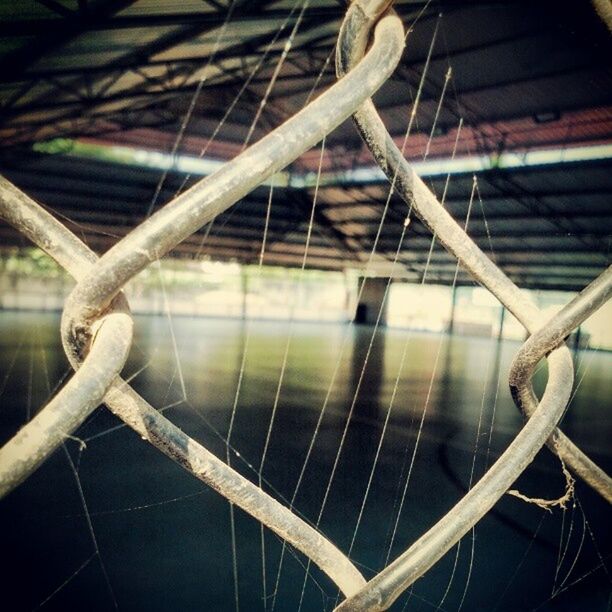 metal, fence, metallic, protection, close-up, chainlink fence, safety, focus on foreground, rusty, rope, railing, security, no people, day, outdoors, part of, chain, wood - material, pattern, high angle view