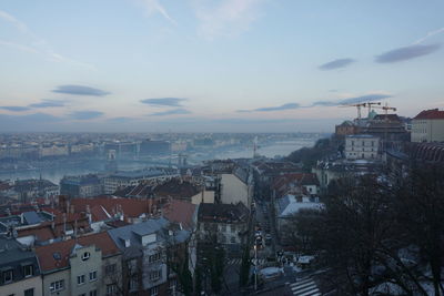 High angle view of buildings in city against sky