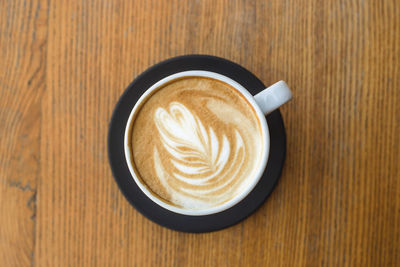 High angle view of cappuccino on table