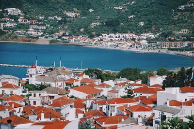 High angle view of townscape by sea