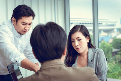 Business people discussing in board room