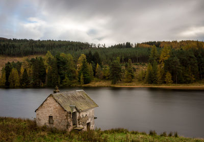 Scenic view of lake and trees against sky