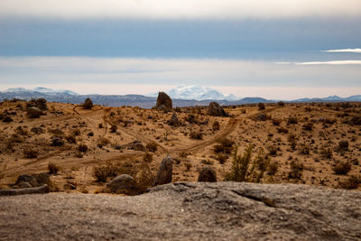 Rock formations on landscape against sky