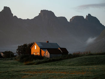 House on field against sky