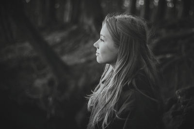 Side view of smiling young woman