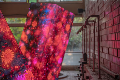 Rear view of man standing on metal staircase