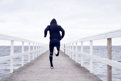 Man jogging on jetty