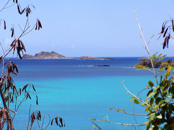 Scenic view of sea against blue sky