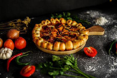 Baked meal with ingredients on table