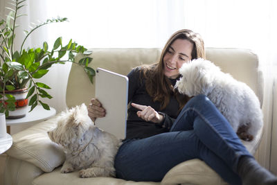 Man and woman with dog at home