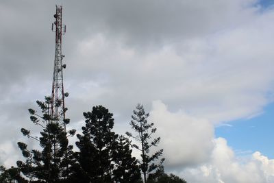 Low angle view of communications tower against sky