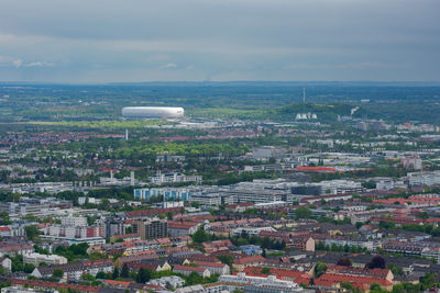 High angle view of city against cloudy sky