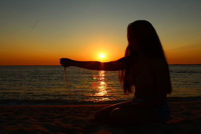 Scenic view of sea at sunset