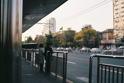 People walking on street in city