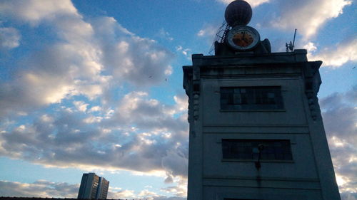 Low angle view of clock tower against sky