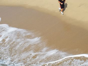 Low section of person on beach