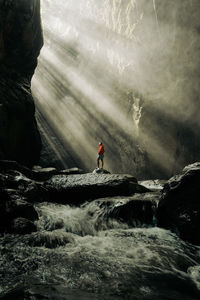 Rear view of man walking on mountain