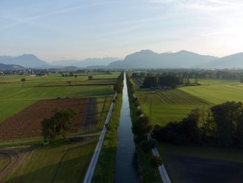 Scenic view of agricultural field against sky