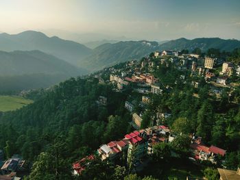 High angle view of trees and mountains against sky