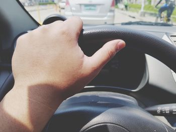 Midsection of man sitting in car