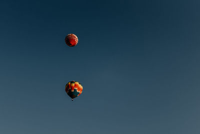 Low angle view of hot air balloon against clear sky