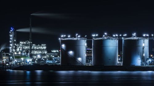 Illuminated industrial building at night