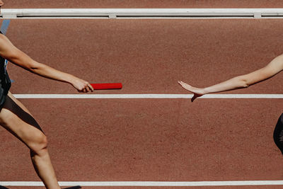 Low section of woman exercising in gym