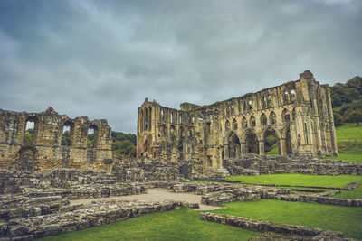 Old ruin building against cloudy sky