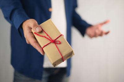 Close-up of human hand holding box