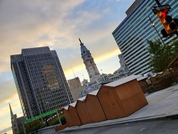 Low angle view of buildings against sky during sunset