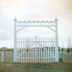 Built structure on field against sky