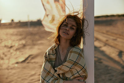 Portrait of young woman looking away