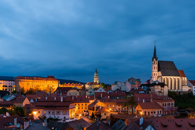 View of buildings in city at dusk