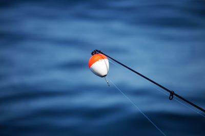 Fishing bait and hook against sea