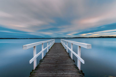 Pier over sea against sky