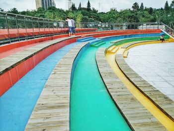 People standing at colorful stairway