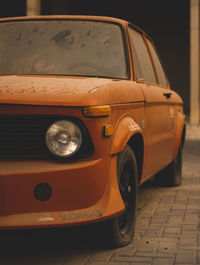 Close-up of vintage car on street