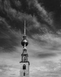 Low angle view of fernsehturm in city against sky