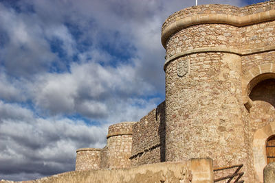 Low angle view of old ruin against sky