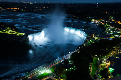 High angle view of illuminated city at night