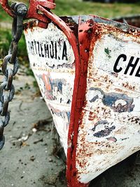 Close-up of text on rusty metal