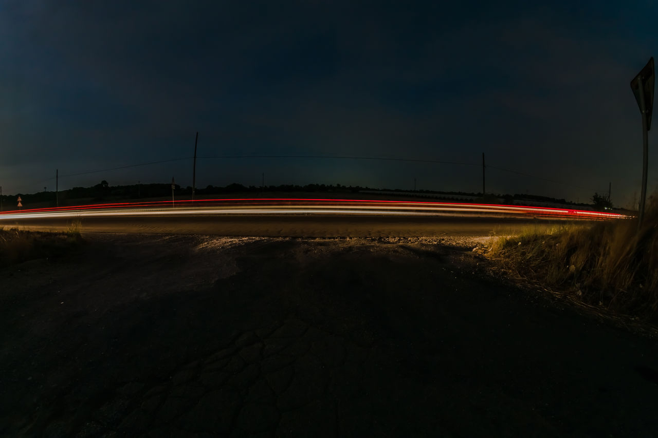 night, light trail, dusk, long exposure, darkness, illuminated, transportation, evening, road, light, sky, motion, speed, horizon, no people, nature, street, blurred motion, sunset, mode of transportation, highway, city, outdoors, tail light, reflection, architecture