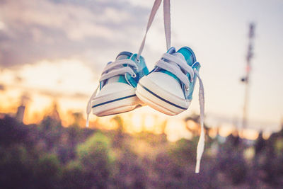 Low angle view of clothes hanging against sky