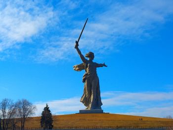 Low angle view of statue against sky