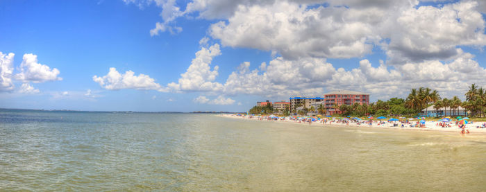 Panoramic view of beach against cloudy sky