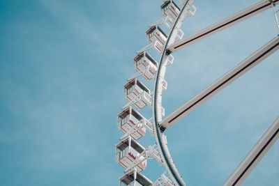 Low angle view of ferris wheel against sky