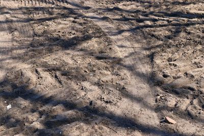 High angle view of shadow on sand